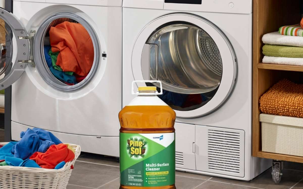 Photo of a washing machine and a laundry basket in front with an overlay of a bottle of Pine-Sol