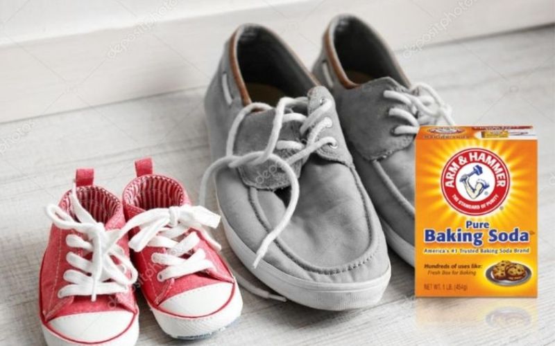 A pair of adult shoe and a pair of kid's shoes with overlay image of a box of baking soda