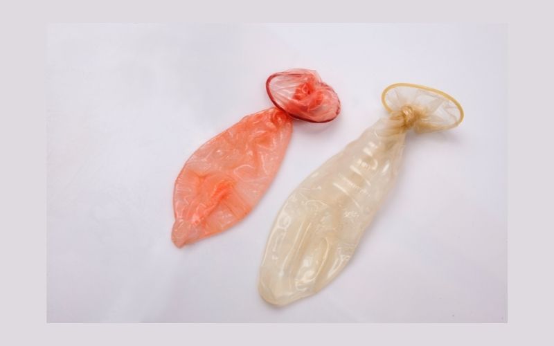 Photo of two condoms tied at the end