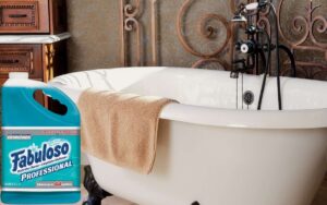 Image showing a bathtub with a towel placed over it and a photo overlay of a container of fabuloso