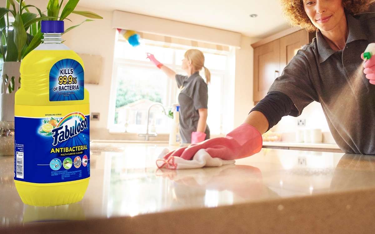 Image of a person cleaning a counter top