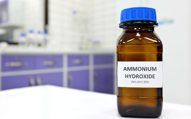 Photo showing a brown bottle with label that reads ammonium hydroxide