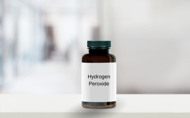 Photo showing a brown bottle with label that reads Hydrogen Peroxide