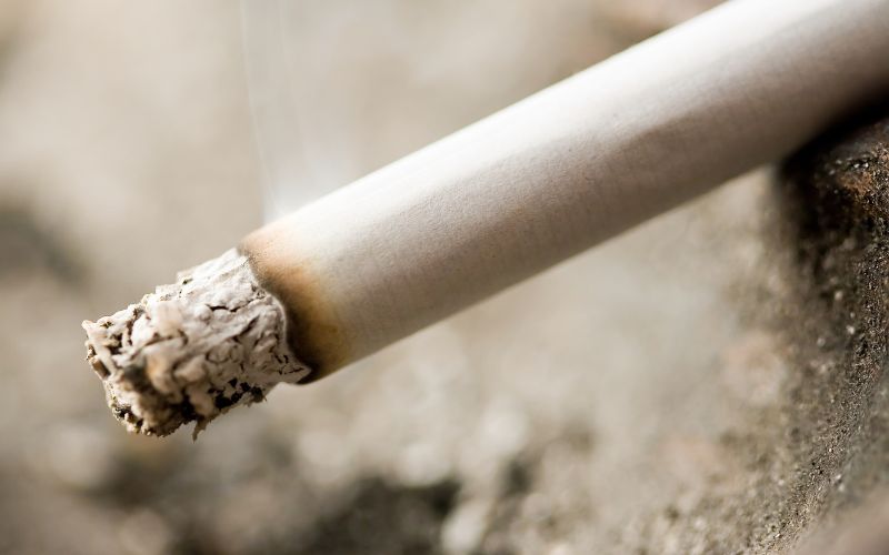Photo showing a lit cigarette