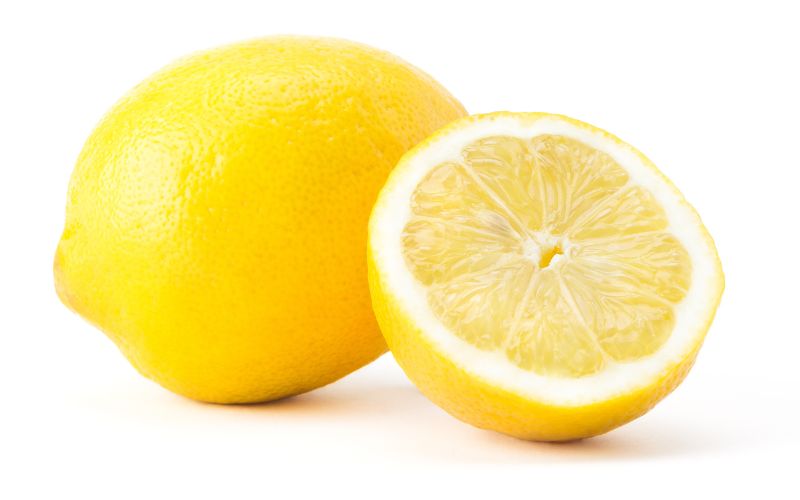 Photo of a whole and a slice of lemon